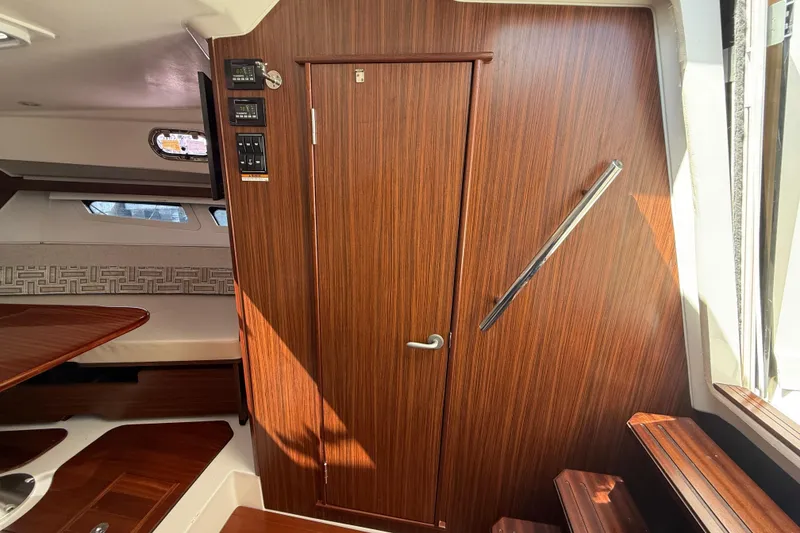 Slide: The Image of 2023 Pursuit OS 355 Offshore cabin interior with wood finish and modern design. - 44