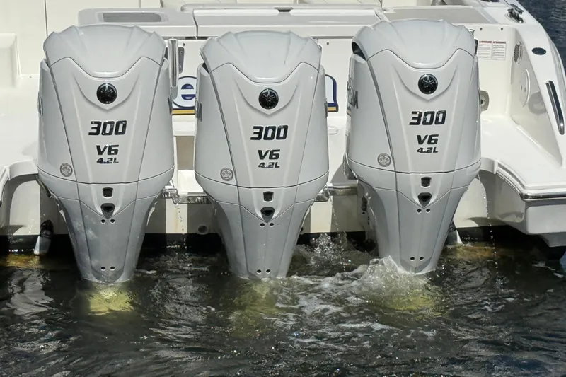 Slide: The Image of Triple Yamaha 300 V6 outboard engines on a 2023 Pursuit OS 355 Offshore boat. - 6