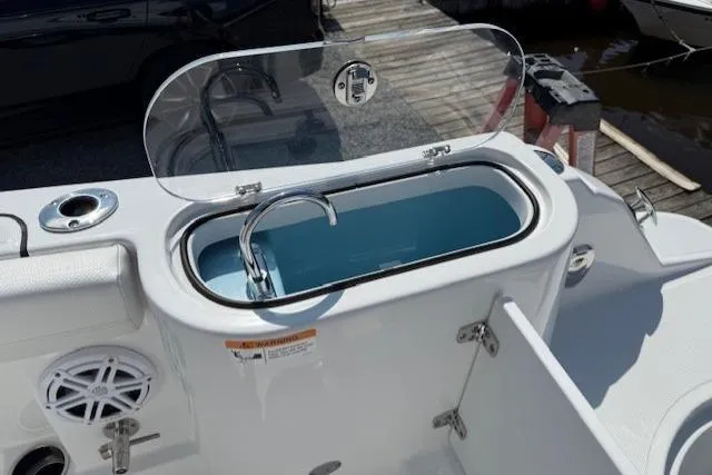 Slide: The Image of 2025 Wellcraft 243 Fisherman boat with open livewell and sleek design. - 16