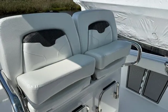 Slide: The Image of 2025 Wellcraft 243 Fisherman boat seats, featuring sleek white and black design. - 8