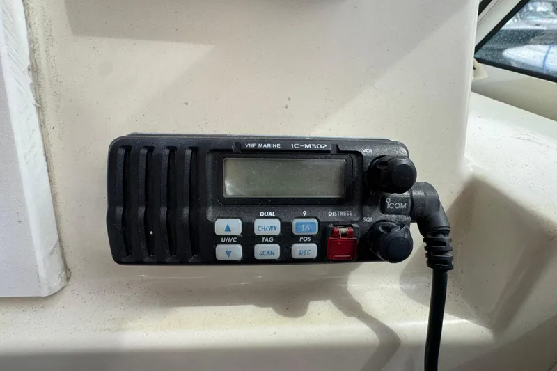 Slide: The Image of VHF marine radio IC-M302 on 2006 Limestone 26 boat dashboard. - 25