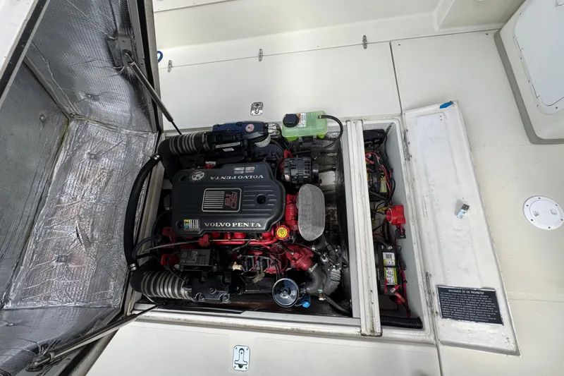 Slide: The Image of Engine compartment of a 2006 Limestone 26 boat featuring a Volvo Penta engine. - 37