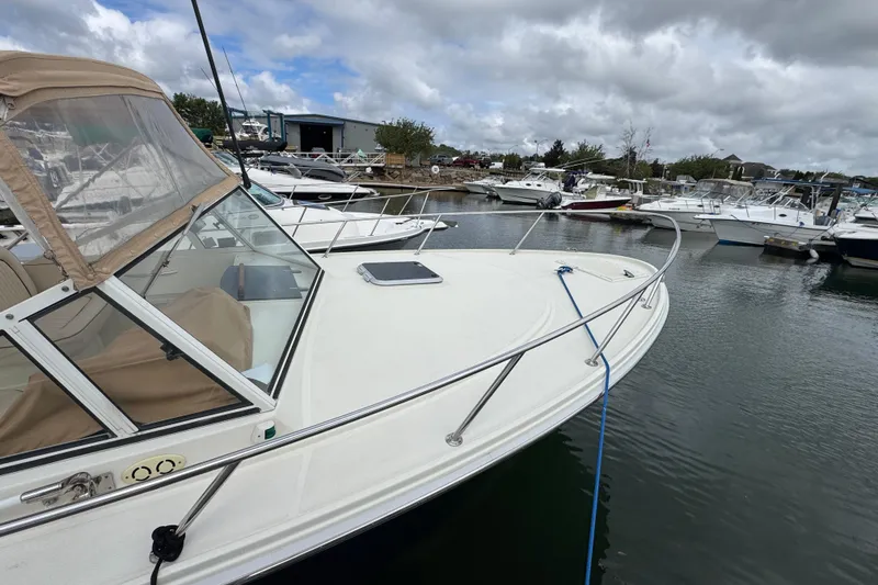 Slide: The Image of 2006 Limestone 26 boat docked in a marina under cloudy skies. - 5
