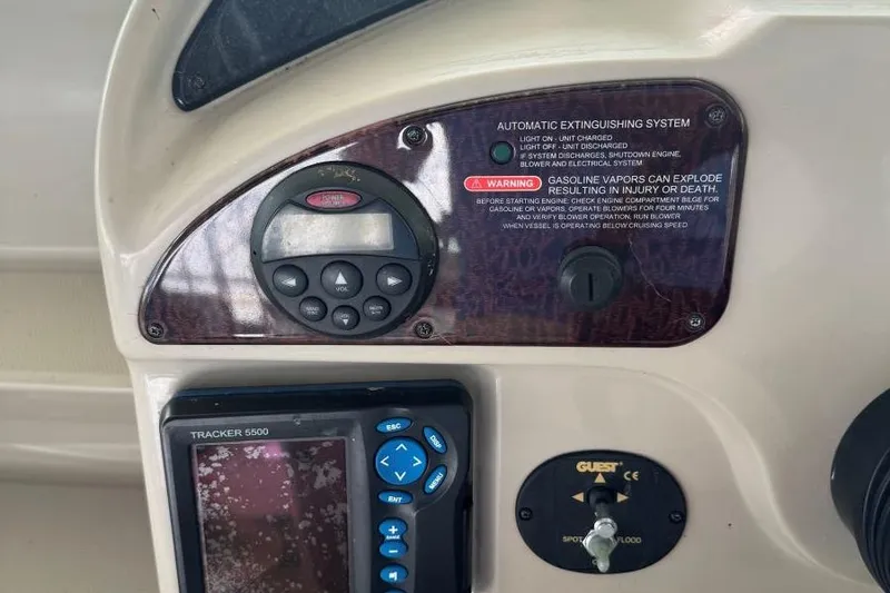 Slide: The Image of Control panel of a 2006 Sea Ray 260 Sundancer boat with warning labels. - 15