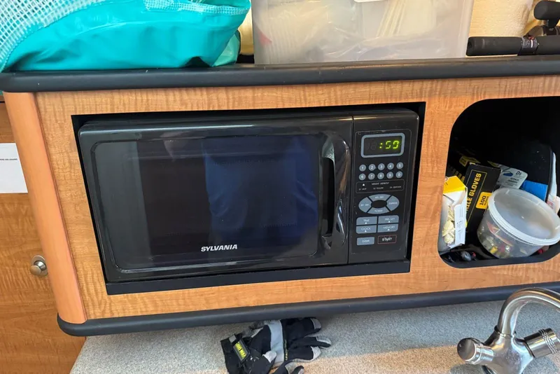 Slide: The Image of Sylvania microwave in 2006 Sea Ray 260 Sundancer boat kitchen area. - 31