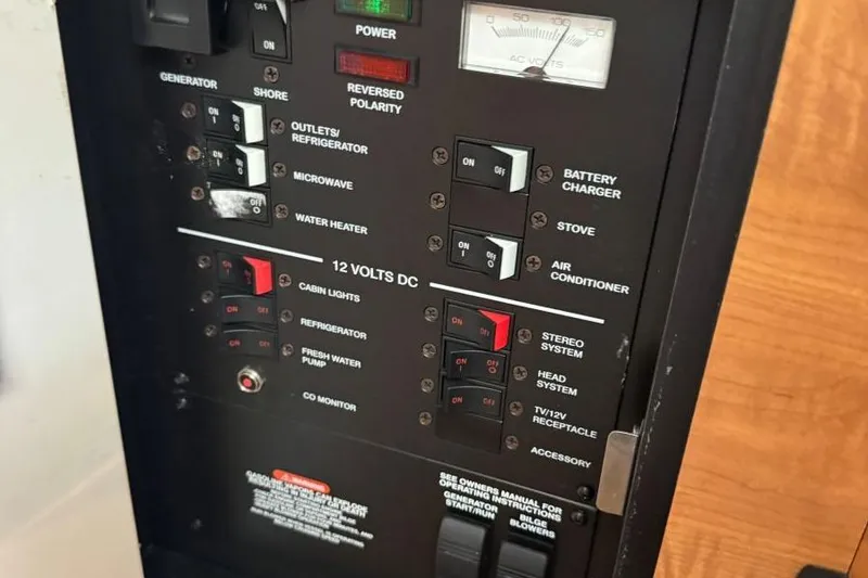 Slide: The Image of Electrical control panel of a 2006 Sea Ray 260 Sundancer boat. - 36