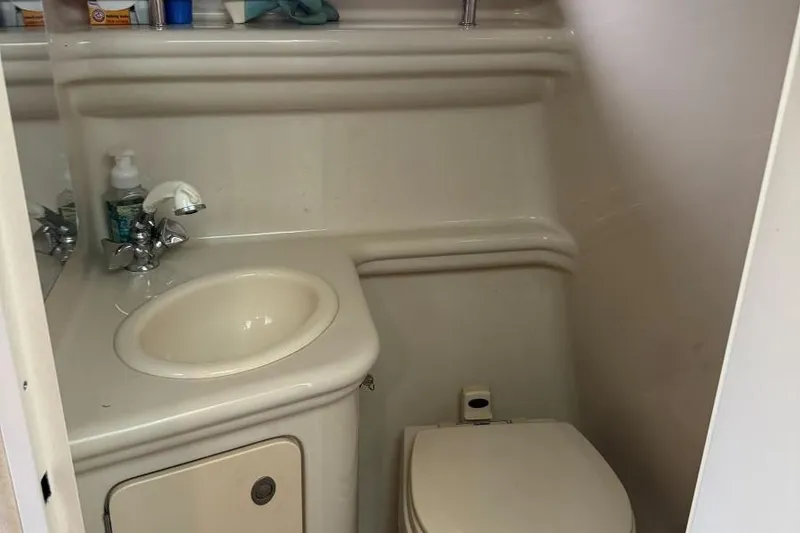 Slide: The Image of 2006 Sea Ray 260 Sundancer bathroom with sink, faucet, and toilet. - 37