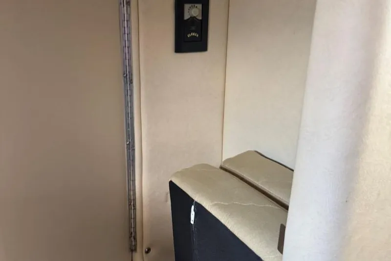 Slide: The Image of Interior of 2006 Sea Ray 260 Sundancer boat cabin with beige upholstery. - 38