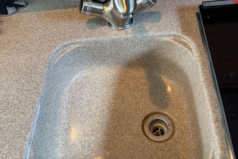 Slide: The Image of Kitchen sink and faucet in 2006 Sea Ray 260 Sundancer boat. - 39