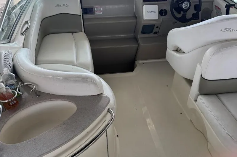 Slide: The Image of Interior of 2006 Sea Ray 260 Sundancer boat with seating and helm. - 9