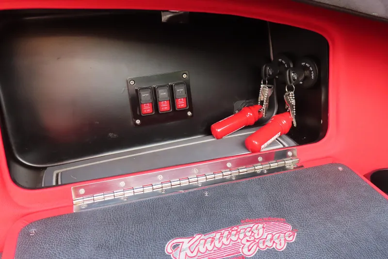 Slide: The Image of Interior of 2021 Wright Performance 360 Carbon with switches and red key fobs. - 16