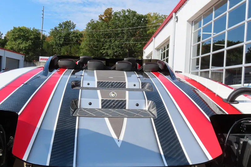 Slide: The Image of 2021 Wright Performance 360 Carbon boat with sleek red, white, and gray design. - 18