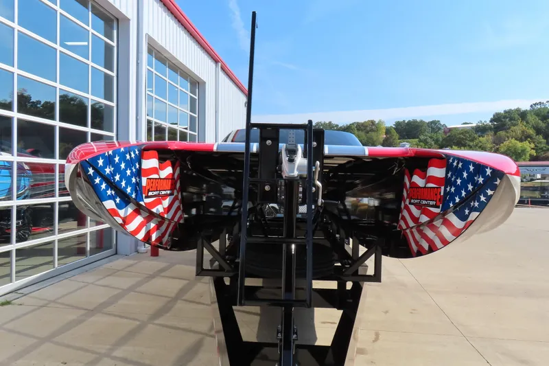 Slide: The Image of 2021 Wright Performance 360 Carbon boat with American flag design, displayed outdoors. - 21