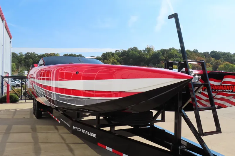Slide: The Image of 2021 Wright Performance 360 Carbon boat on trailer, vibrant red and white design. - 22