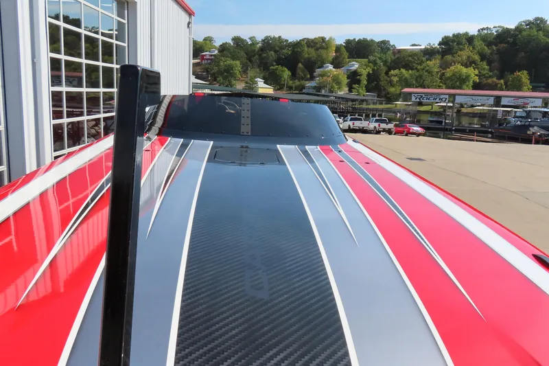 Slide: The Image of Red and gray Wright Performance 360 Carbon boat, 2021 model, with sleek design and carbon fiber detailing. - 23