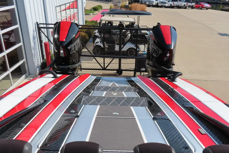 Slide: The Image of 2021 Wright Performance 360 Carbon boat with dual outboard motors, red and black design. - 4