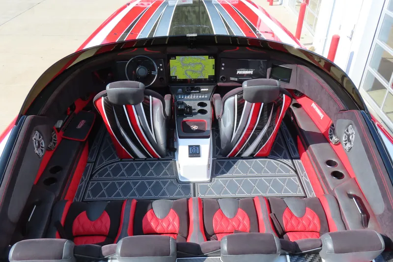 Slide: The Image of Luxurious interior of 2021 Wright Performance 360 Carbon boat with red and black seating. - 6