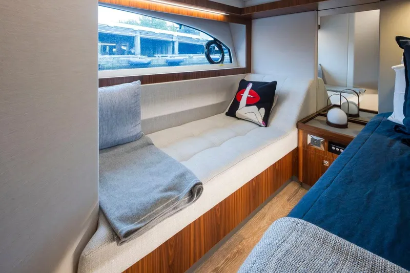 Slide: The Image of Luxurious interior of 2023 Riviera 505 SUV yacht with elegant seating and modern decor. - 13