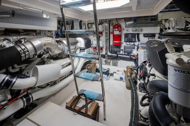 Slide: The Image of Engine room of 2023 Riviera 505 SUV yacht, featuring advanced mechanical systems and equipment. - 47