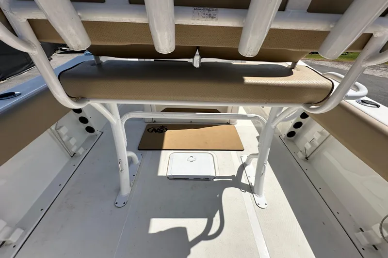 Slide: The Image of 2020 NauticStar 2302 Legacy boat interior with seating and storage compartments. - 19