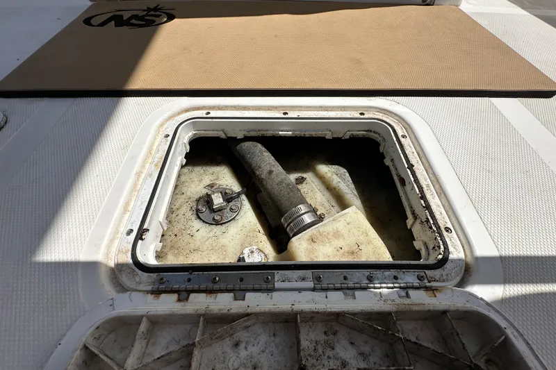 Slide: The Image of Open hatch on 2020 NauticStar 2302 Legacy boat, revealing internal components. - 21