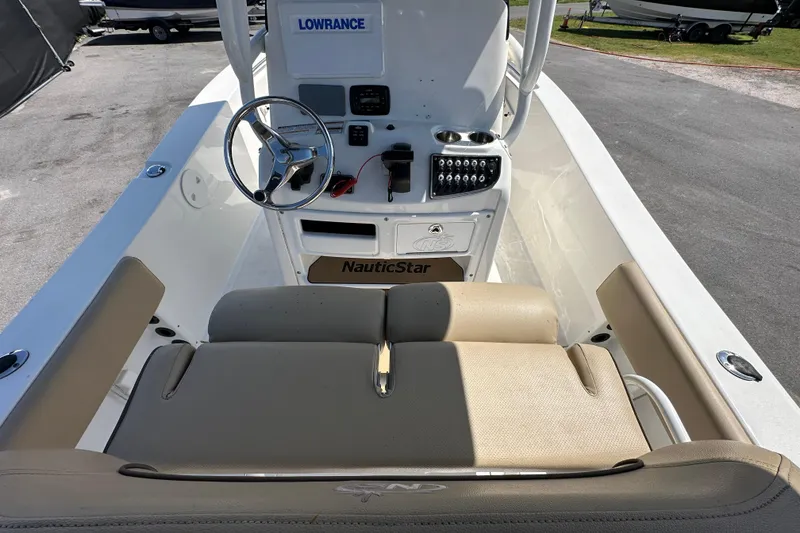 Slide: The Image of 2020 NauticStar 2302 Legacy boat interior with steering wheel and control panel. - 31