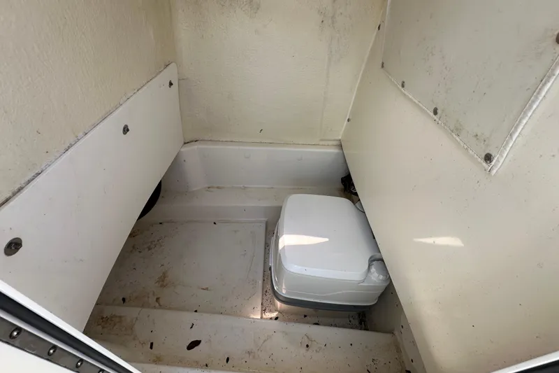 Slide: The Image of 2020 NauticStar 2302 Legacy boat interior with compact toilet. - 44