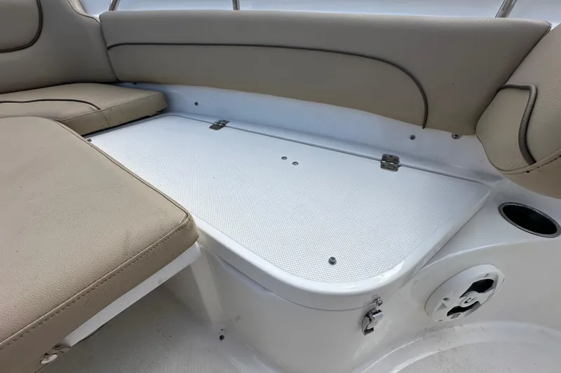 Slide: The Image of 2020 NauticStar 2302 Legacy boat interior seating with storage compartment. - 57