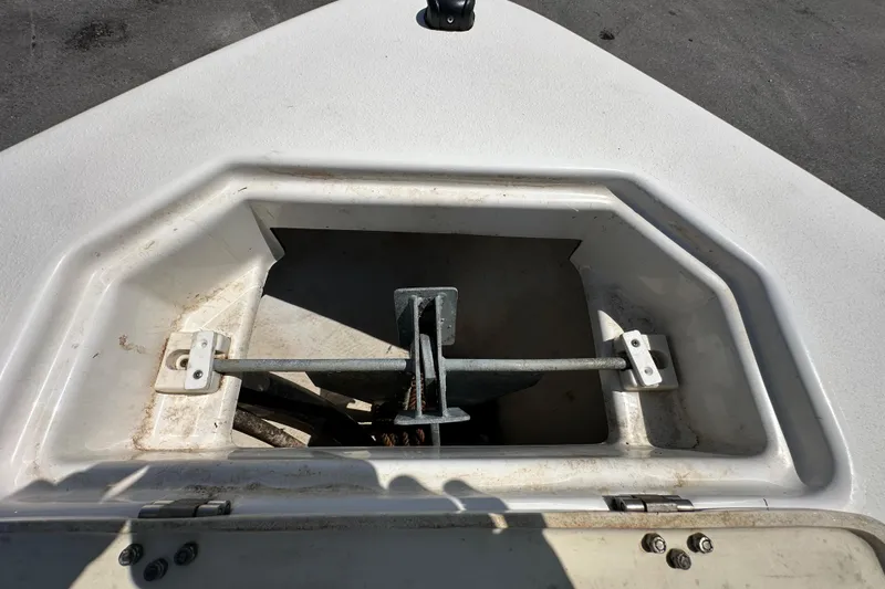 Slide: The Image of Anchor storage compartment on 2020 NauticStar 2302 Legacy boat, open and empty. - 61