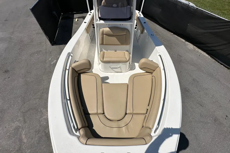 Slide: The Image of 2020 NauticStar 2302 Legacy boat with tan seating, viewed from above. - 64