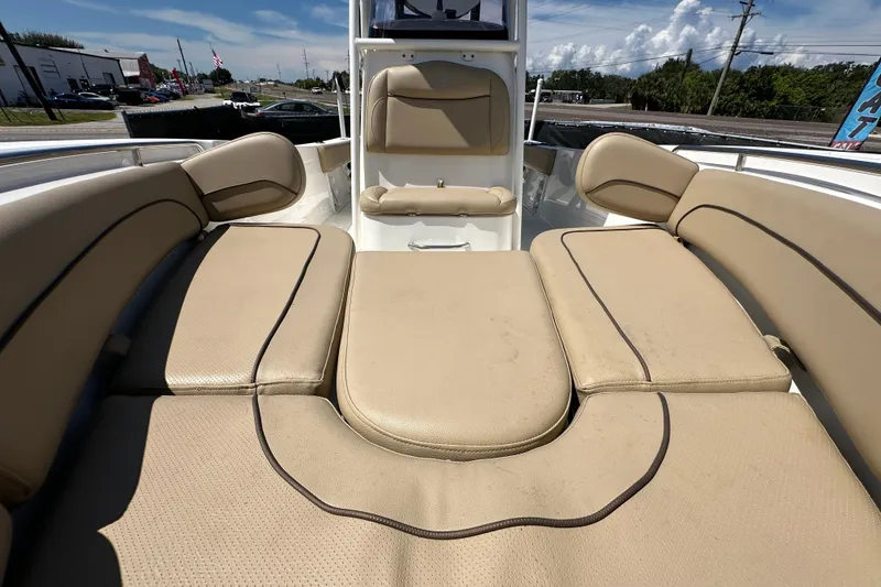 Slide: The Image of 2020 NauticStar 2302 Legacy boat interior with beige cushioned seating. - 66