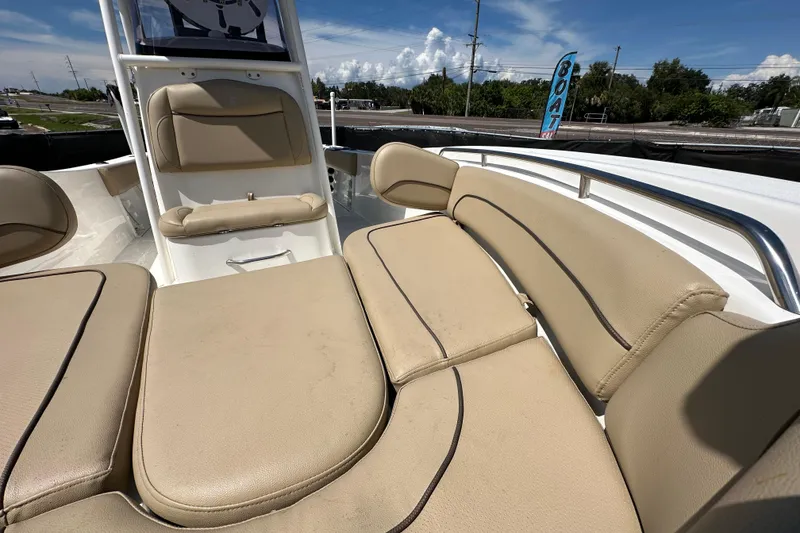 Slide: The Image of 2020 NauticStar 2302 Legacy boat interior with beige cushioned seating. - 67