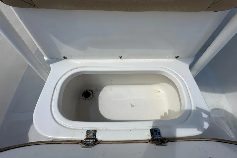 Slide: The Image of Open storage compartment on 2020 NauticStar 2302 Legacy boat. - 72