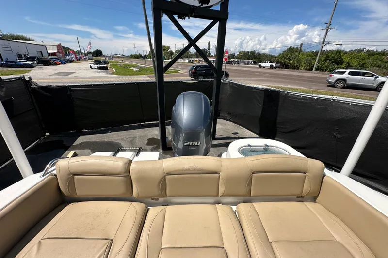 Slide: The Image of 2020 NauticStar 2302 Legacy boat with Yamaha 200 engine, parked outdoors. - 83