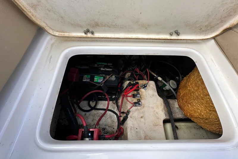 Slide: The Image of Battery compartment of 2020 NauticStar 2302 Legacy boat with wiring and components. - 87