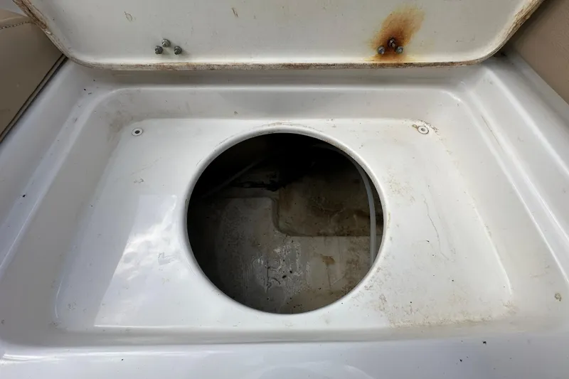 Slide: The Image of Open storage compartment on 2020 NauticStar 2302 Legacy boat, showing interior details. - 91