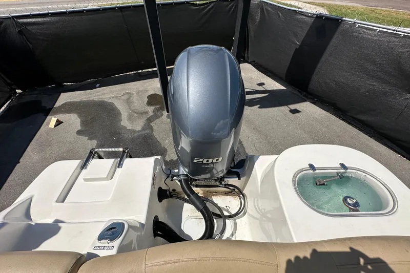 Slide: The Image of 2020 NauticStar 2302 Legacy boat with Yamaha 200 engine, rear view. - 93