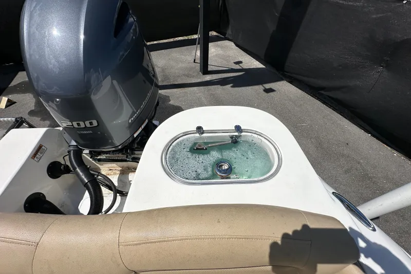 Slide: The Image of 2020 NauticStar 2302 Legacy boat with Yamaha 200 engine and livewell. - 94
