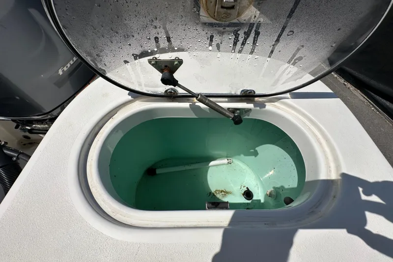 Slide: The Image of Open livewell on 2020 NauticStar 2302 Legacy boat, showing interior details. - 95