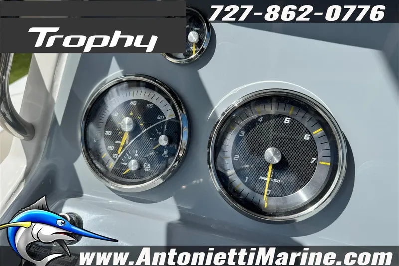 Slide: The Image of Dashboard of 2026 Trophy T20CC Center Console boat with gauges and branding. - 13