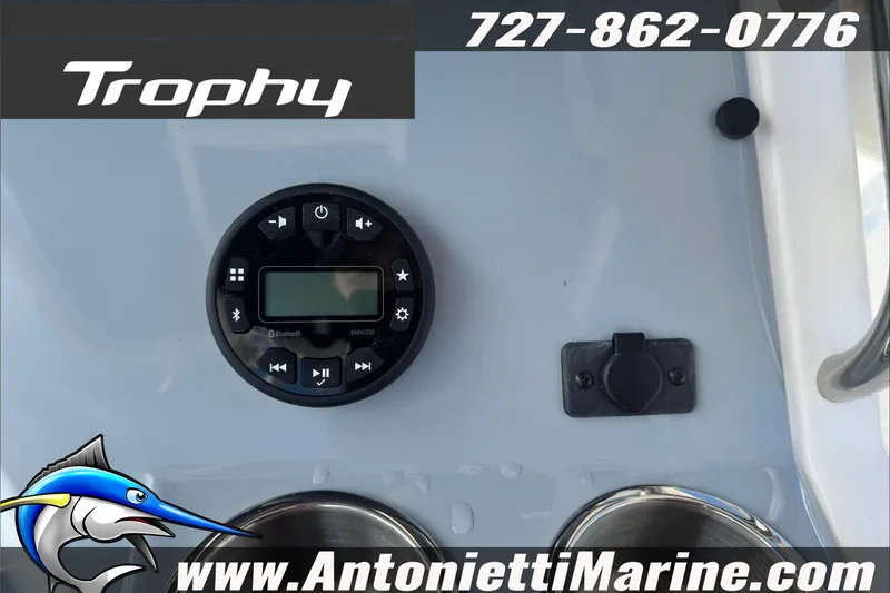 Slide: The Image of Control panel of 2026 Trophy T20CC Center Console boat with Bluetooth audio system. - 14