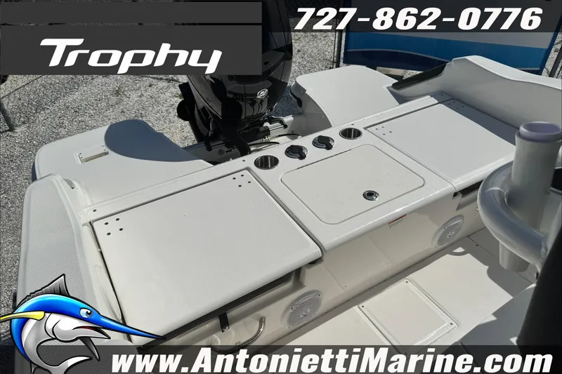 Slide: The Image of 2026 Trophy T20CC Center Console boat interior with storage and cup holders. - 24