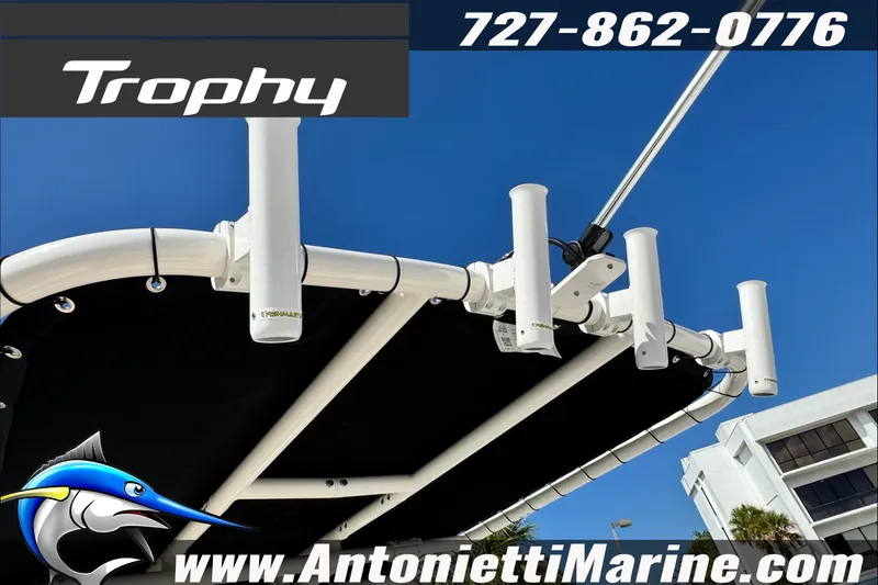 Slide: The Image of 2026 Trophy T20CC Center Console boat with rod holders, blue sky background. - 31