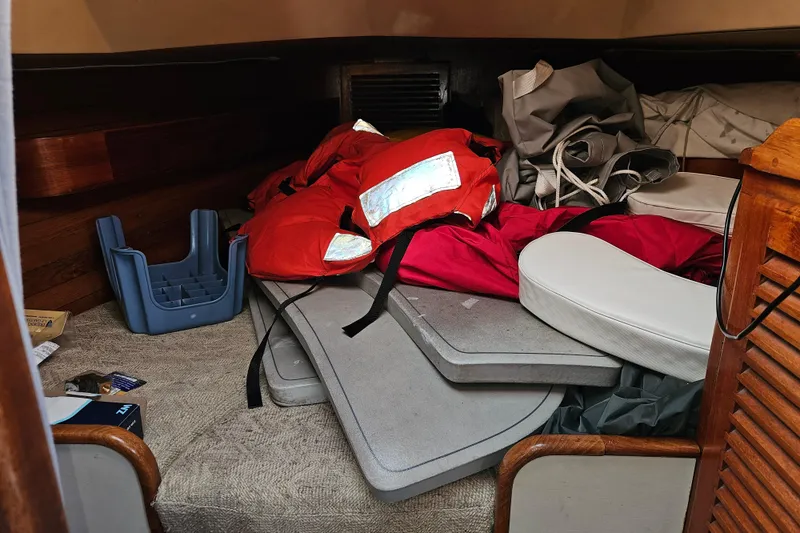 Slide: The Image of Interior of 1979 Fast Passage 39 sailboat with life jackets and cushions. - 30