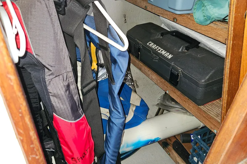 Slide: The Image of Storage area on a 1979 Fast Passage 39 boat with tools and gear. - 35