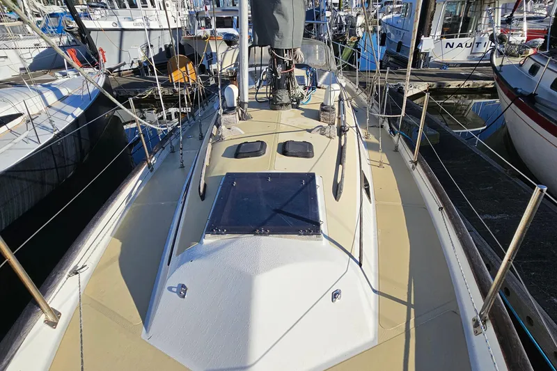 Slide: The Image of 1979 Fast Passage 39 sailboat deck view at marina. - 5