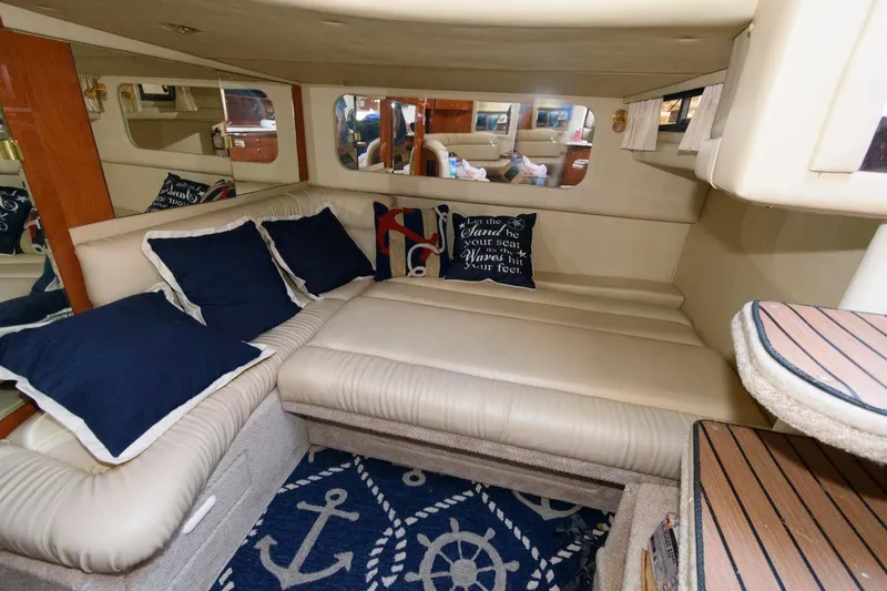 Slide: The Image of Luxurious interior of 2000 Sea Ray 380 Sundancer with nautical-themed decor. - 14
