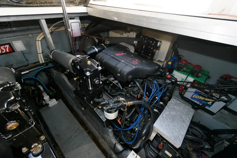 Slide: The Image of Engine room of 2000 Sea Ray 380 Sundancer with visible components and wiring. - 18