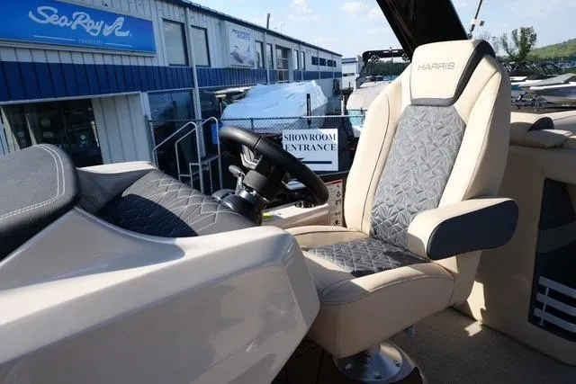 Slide: The Image of 2026 Harris Grand Mariner 250 helm with luxurious seating and modern steering wheel. - 11