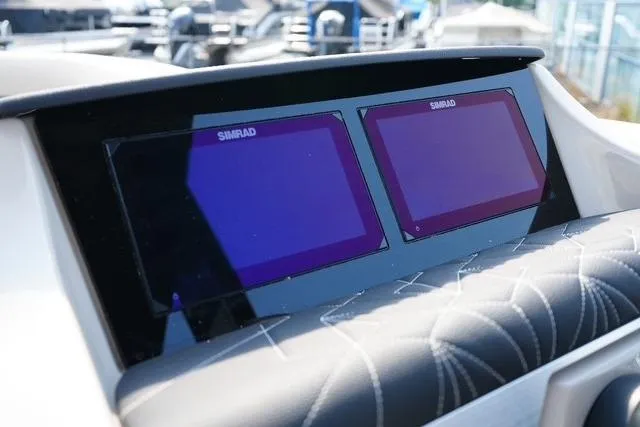 Slide: The Image of Dual Simrad displays on 2026 Harris Grand Mariner 250 boat dashboard. - 13